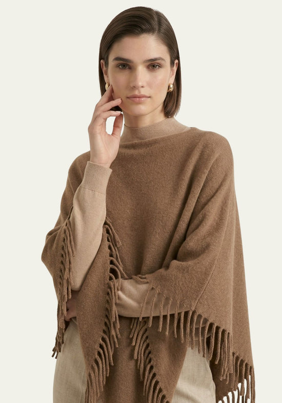 Women’s fringed poncho in a warm camel shade, one size