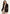 Women's blazer in suede, dark brown, worn by a woman with a roll-neck top and trousers.
