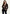Women's blazer in suede, dark brown, worn by a woman, with lapels and a slim fit.