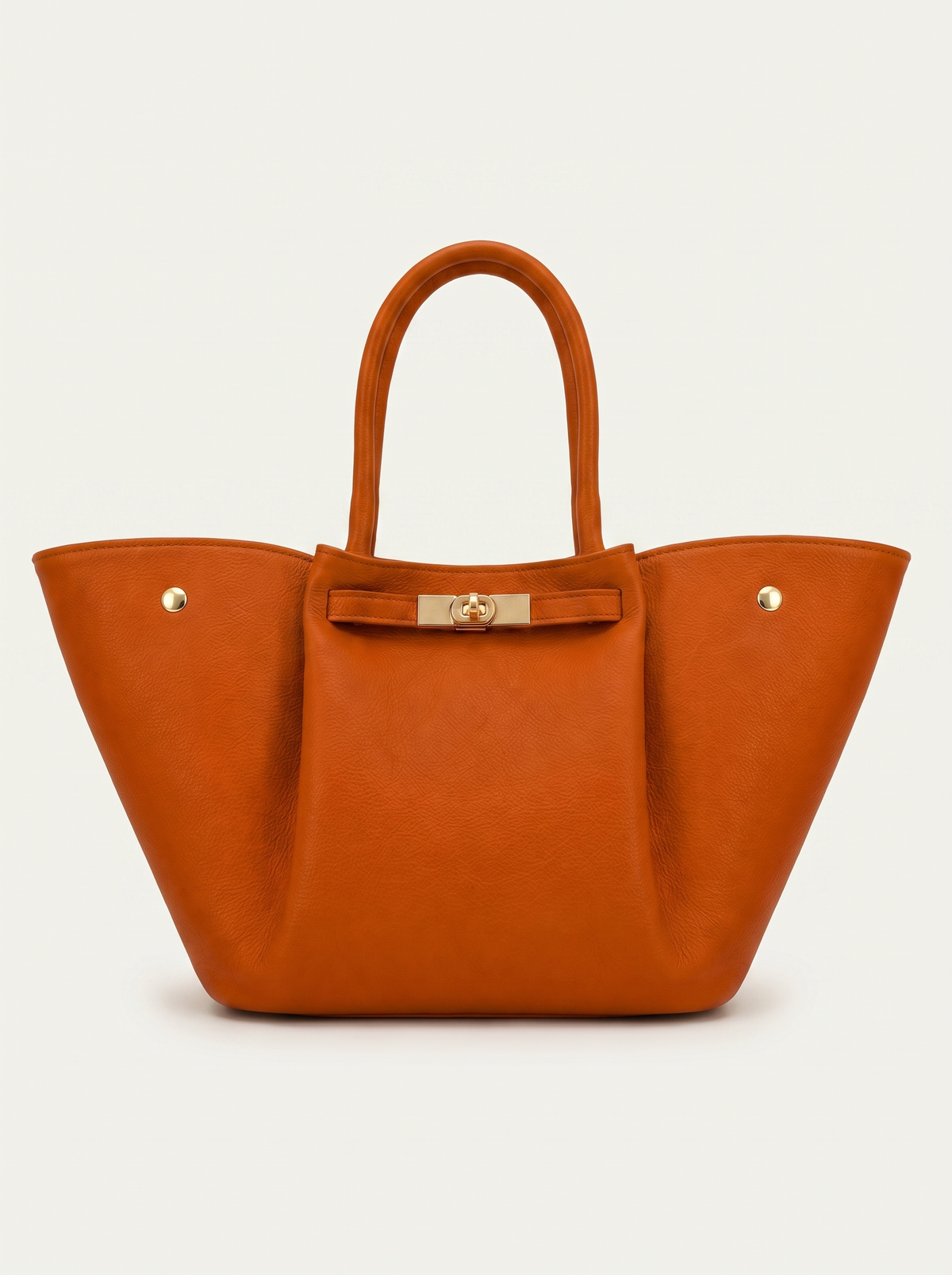 Women's leather handbag in cognac, shown from the front with handles, clasp detail and a wide shape.