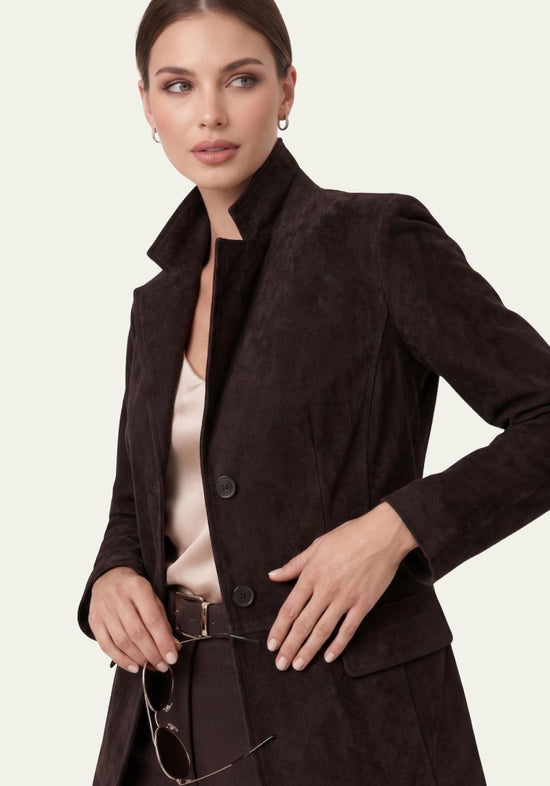 Women's jacket in black suede on the model, shown at a half-side angle with a raised collar.