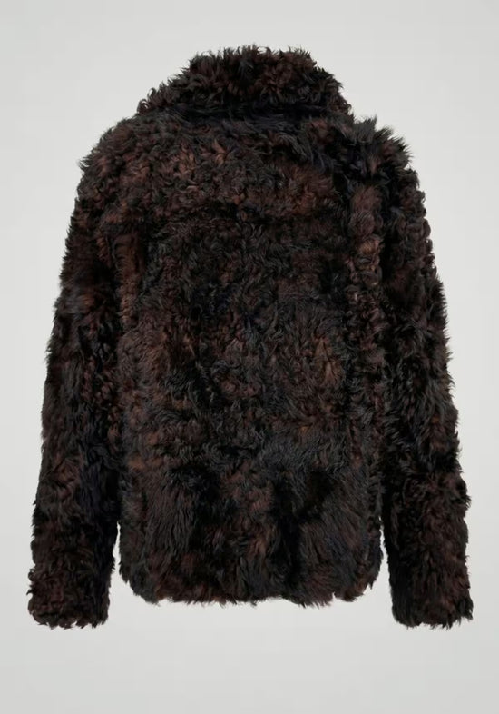 Women's curly sheepskin jacket in dark brown, shown from the back, cut free.