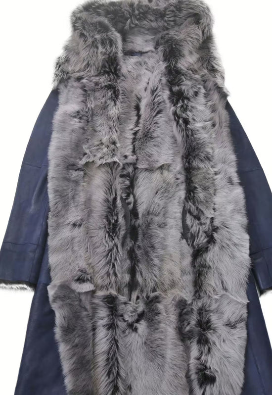Inside view of the women's sheepskin coat in dark blue with grey curly sheepskin and leather details