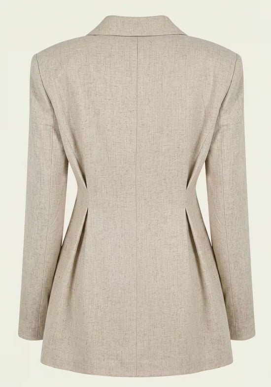 Beige women’s linen blazer shown from the back with a fitted shape and side slits.
