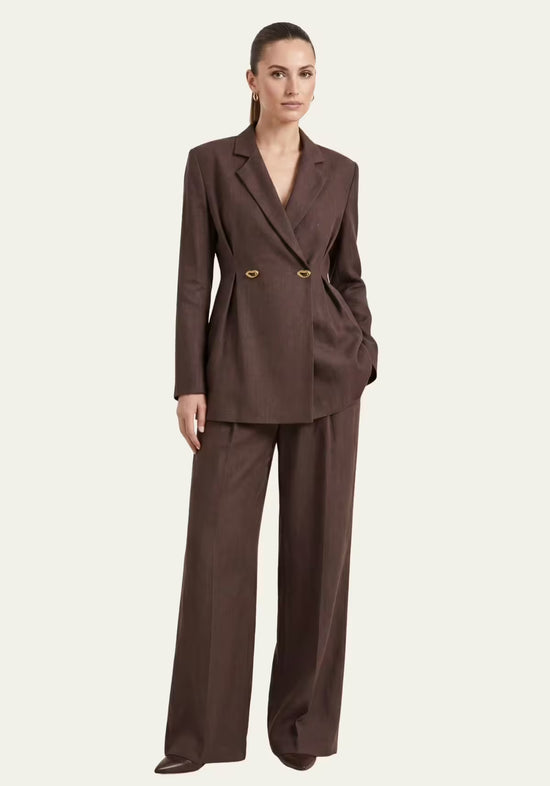 Women's linen blazer with palazzo trousers in brown, shown worn from the front.