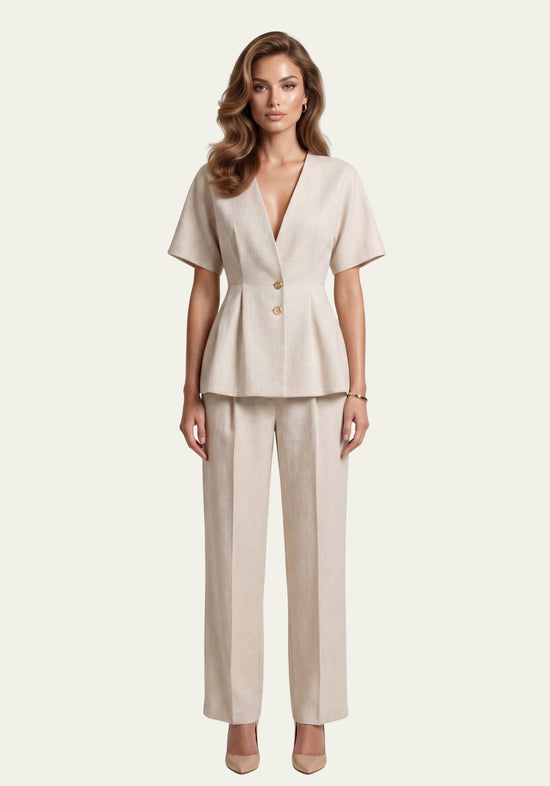 Women's linen set in beige with wrap blazer and palazzo trousers, worn frontally on a model.