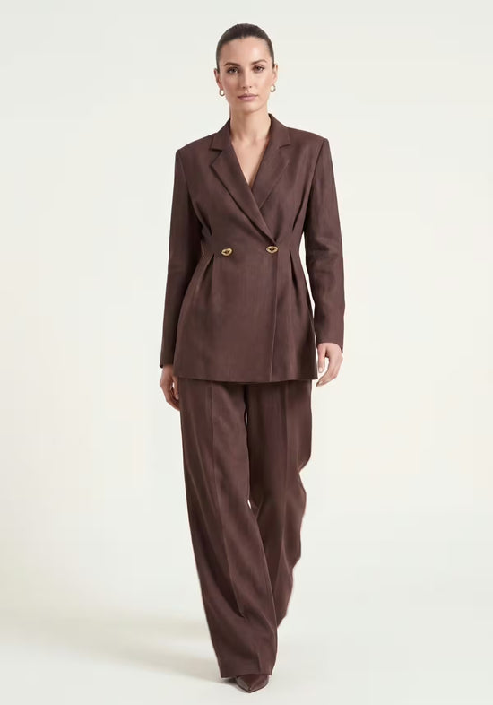 Women's linen set in brown with blazer and palazzo trousers, shown worn from the front.