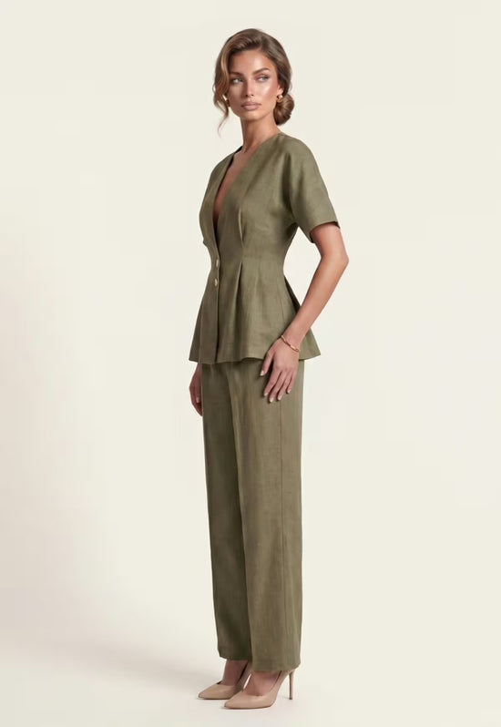 Women's linen set in khaki, worn from the side with wrap blazer and palazzo trousers