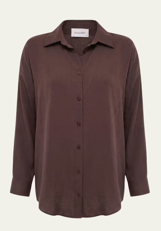 Brown women’s linen shirt shown from the front with button fastening and long sleeves.