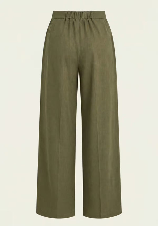 Back view of the khaki women's linen trousers with an elastic waistband and wide cut.