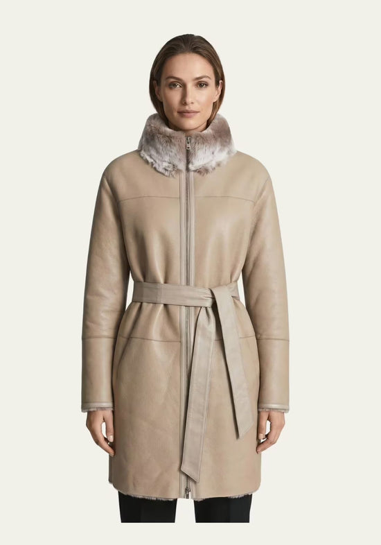 Taupe-beige sheepskin women's coat with stand collar, front view on model