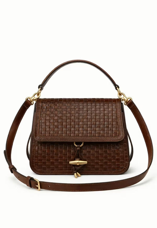 Women’s leather handbag in dark brown with an additional shoulder strap, front view on white.