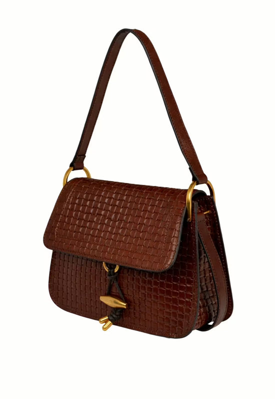 Women’s leather handbag in dark brown, side view with flap and shoulder strap.