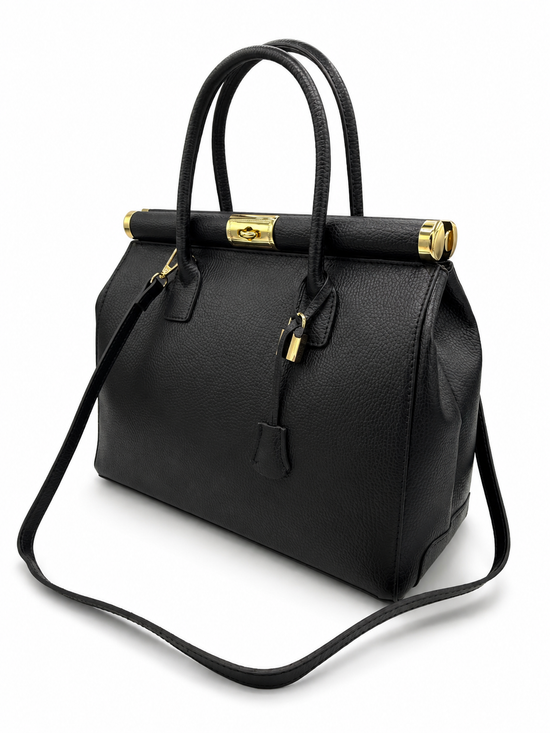 Black ladies' leather handbag in an angled view with gold-coloured details