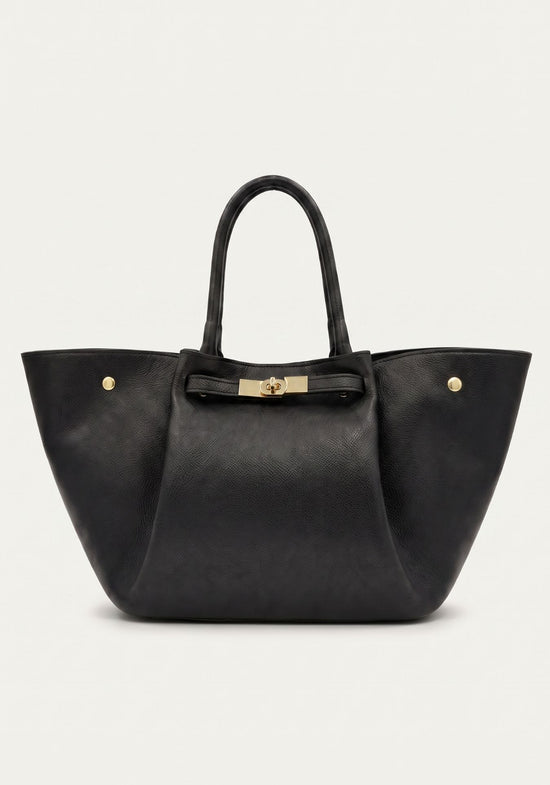 Black women’s leather handbag shown from the front with gold-tone details.