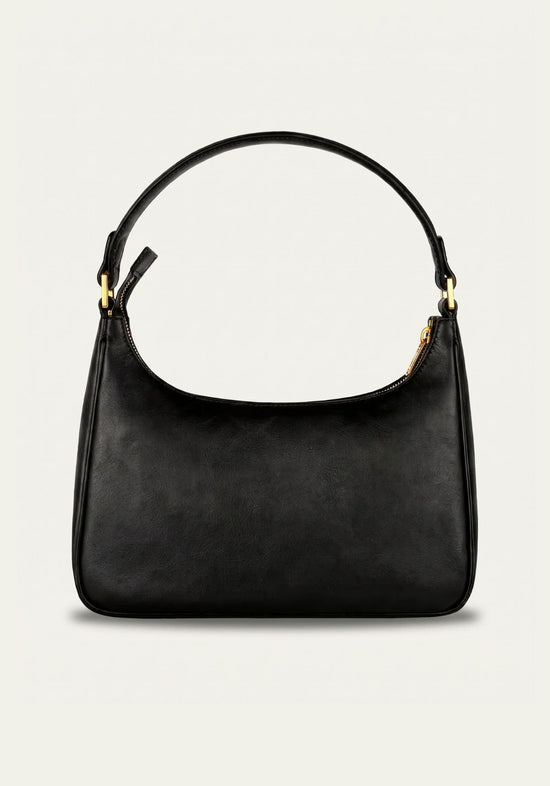 Black women’s leather handbag shown from the front with a round handle