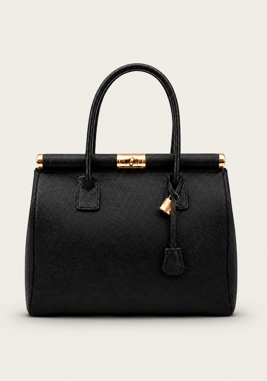 Black ladies' leather handbag shown from the front with gold-coloured fastening