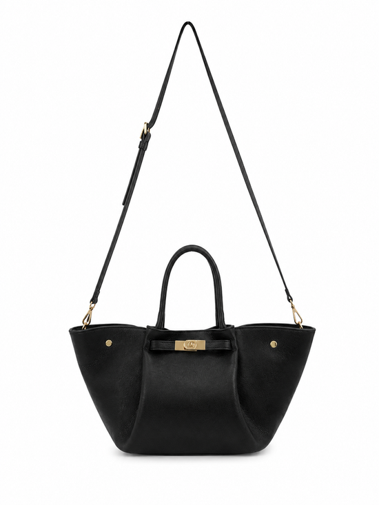 Black women’s leather handbag isolated with a long shoulder strap.