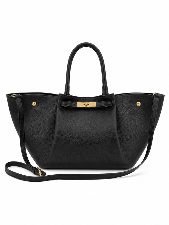 Black women’s leather handbag isolated in front view with shoulder strap.