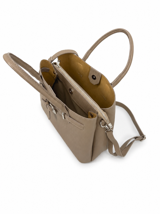 Open taupe leather women’s handbag showing inner compartments and a light lining.