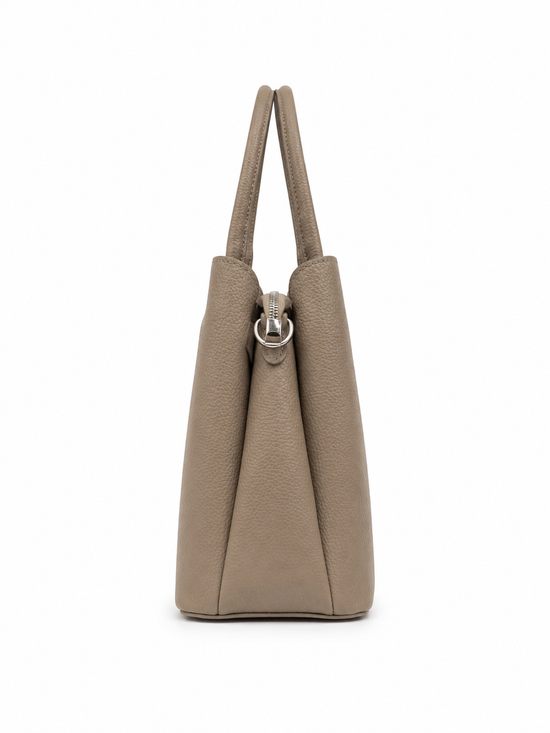 Side view of the taupe women’s leather handbag with a slim silhouette.