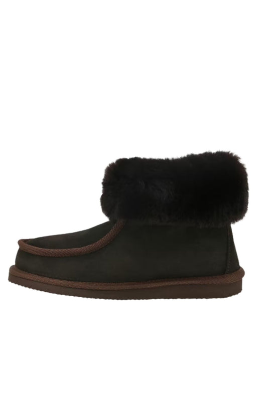 Sheepskin and suede slipper in brown, isolated in side view with a fur collar.