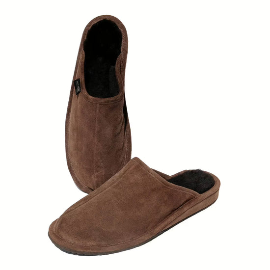 Two men's sheepskin slippers in brown suede, shown with one upright and one lying down.