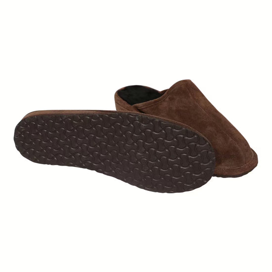 Men's sheepskin slipper in brown suede, shown from below with a textured rubber sole.