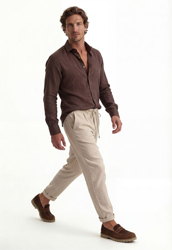 Men’s linen shirt in brown, worn by a man in side view while walking.