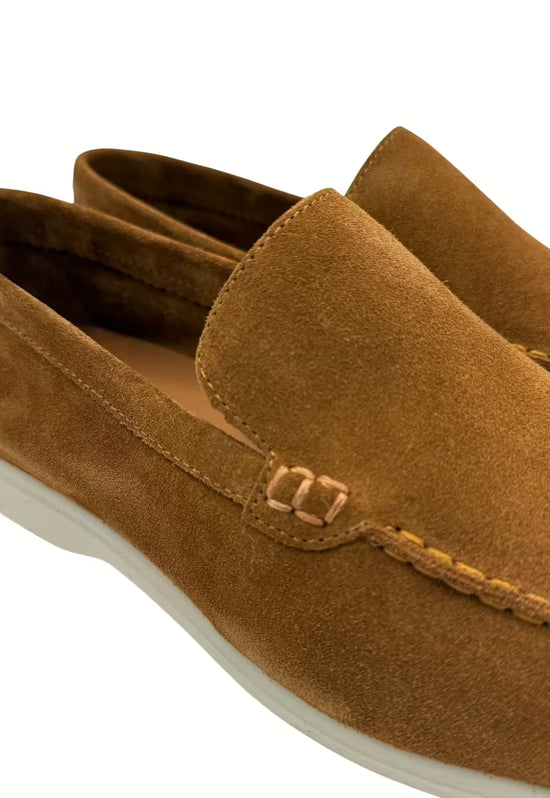Detail of a men's loafer in whisky calf suede with decorative stitching