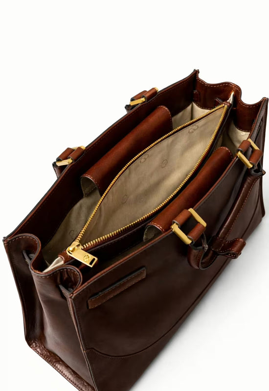 Open brown leather hobo bag with light lining and a gold-coloured zipped pocket inside.