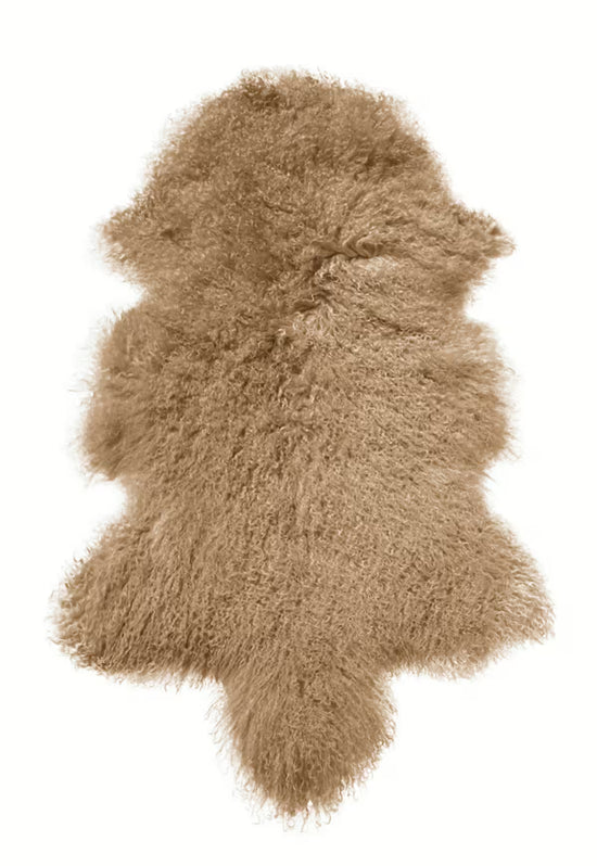 Cut-out Tibetan sheepskin in cappuccino with curly, dense pile on a white background