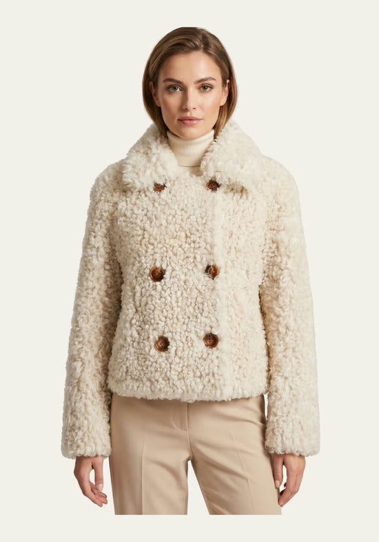 Cream curly sheepskin jacket for women worn from the front, with a wide collar and double row of buttons