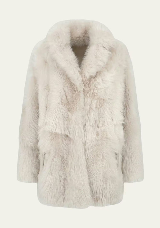 Cream-beige sheepskin jacket for women shown front-on, freestanding, with a large collar.