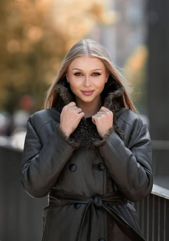 Women’s olive sheepskin jacket worn reversed, with the leather side outside and shearling collar.