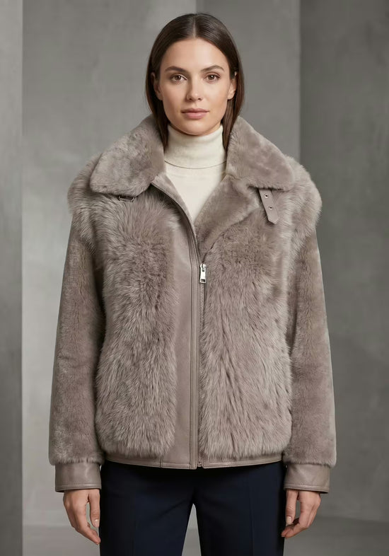 Women's sheepskin jacket in taupe, front view on a model with an open zip
