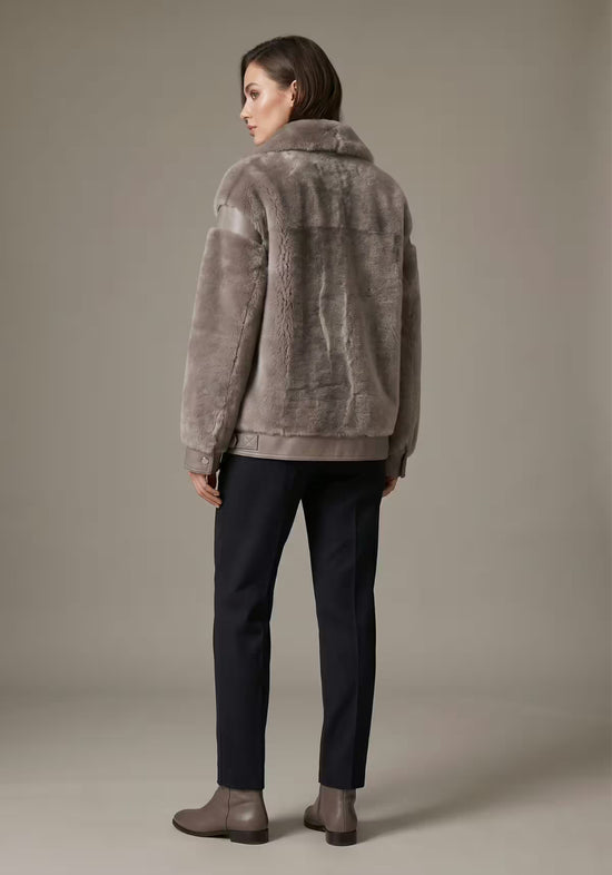 Women's sheepskin jacket in taupe, back view on a model with a smooth back panel