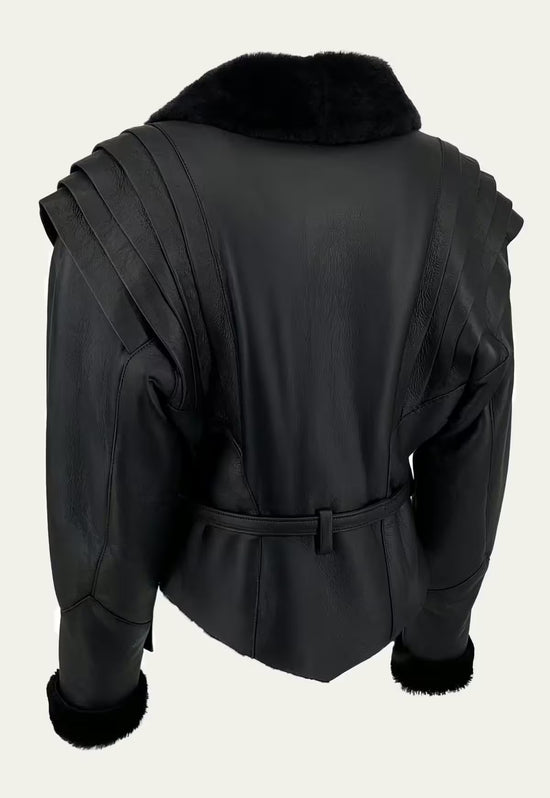 Back view of the black women's sheepskin jacket with belt, stitched shoulders and shearling collar.