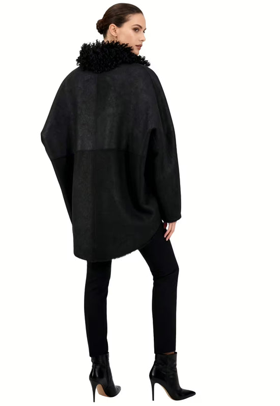 Black women's sheepskin jacket worn by a model from the back, with a loose shape and curly collar.