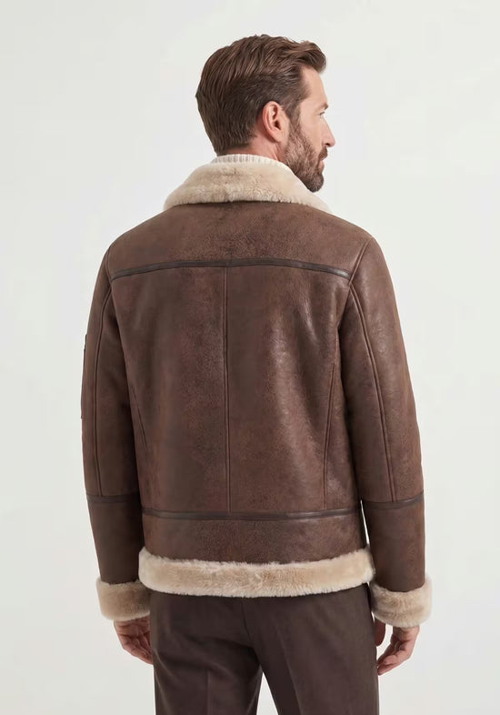 Rear view of the men's sheepskin jacket in mahogany with a light hem and collar.