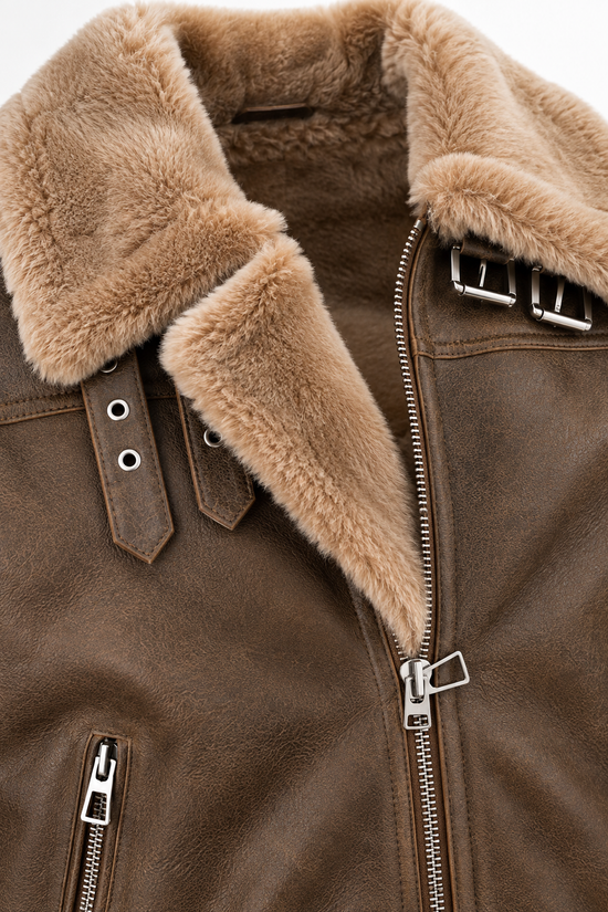 Detail view of the soft merino sheepskin collar on the men's jacket in walnut and cappuccino.