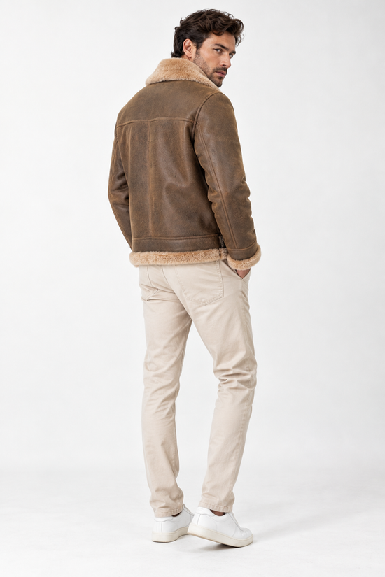 Men's sheepskin jacket made from merino sheepskin in walnut and cappuccino, back view on model.
