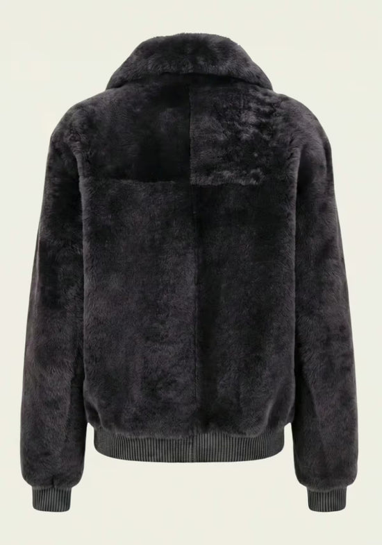 Back view of the women's shearling sheepskin jacket in anthracite with a wide collar