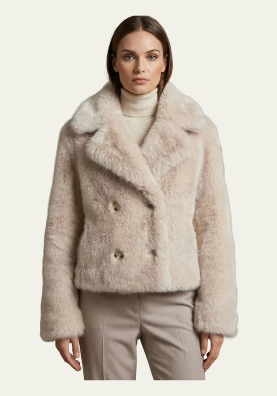 Women’s sheepskin jacket in cream-beige, shown worn by the model from the front.