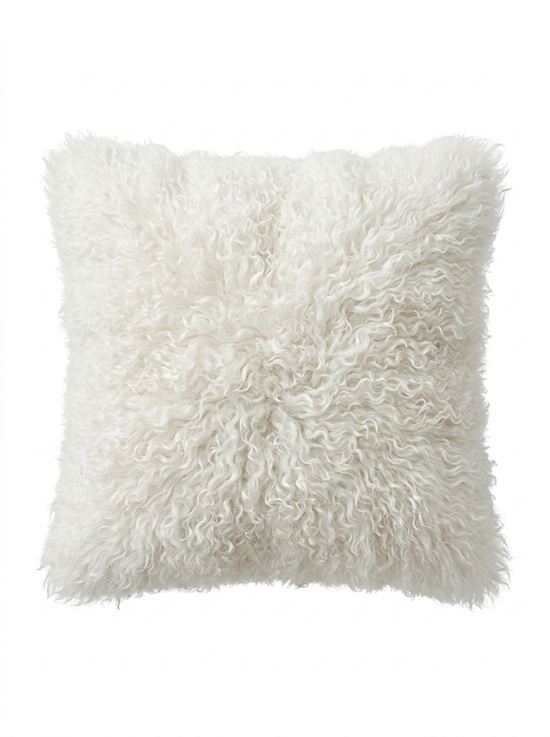 White sheepskin cushion in a front view, with dense curly wool, isolated on a light background.