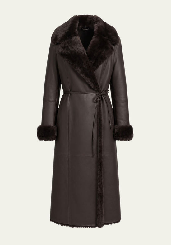 Brown sheepskin coat for women shown front-on, cut out on white, with fur collar and tie belt.