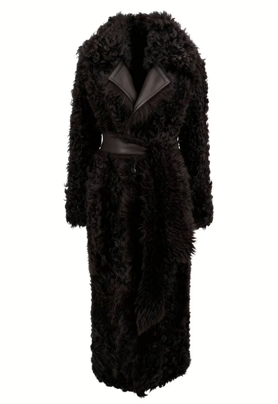 Women's sheepskin coat in dark brown, photographed closed, with wide lapels and dense curly sheepskin.