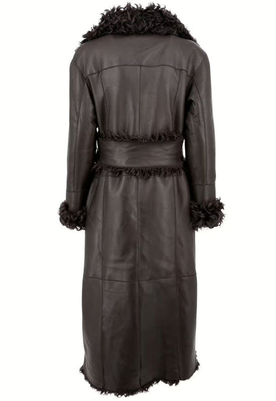 Rear view of the women's sheepskin coat in dark brown with a waist belt and fur trim at the collar and cuffs.