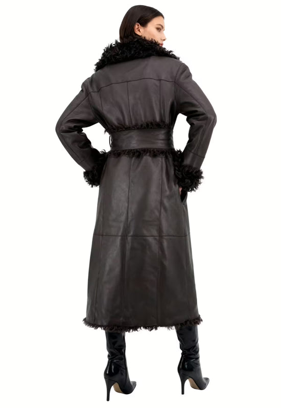 Back view of the women's sheepskin coat in dark brown, with a fitted waist and long cut.