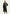 Black women’s sheepskin coat worn on a model, open at the front with a tie belt.